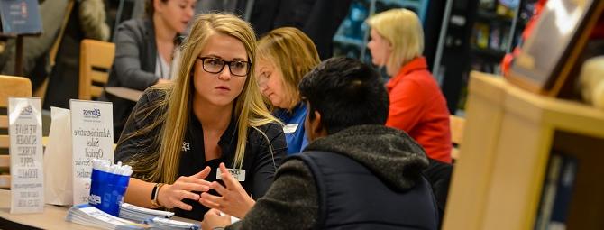 employer meeting with a student at career event